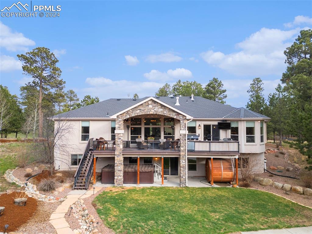 11628 Shaugnessy Road Colorado Springs, CO 80908 - Photo 37 of 50 a front view of a house with a yard