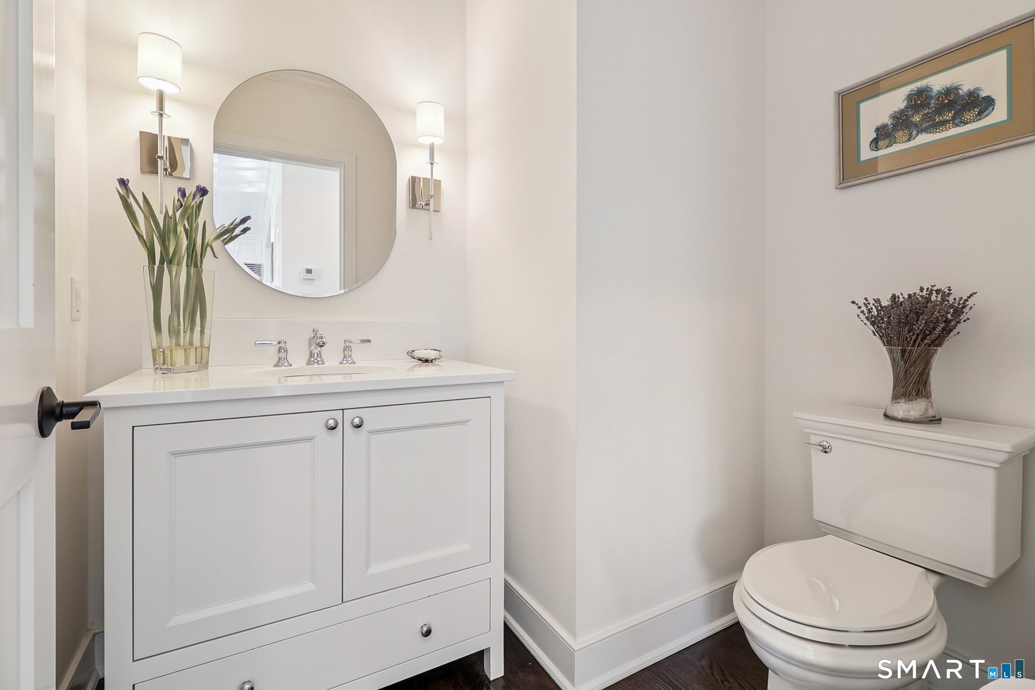 485 Westway Road, Unit 485 Fairfield, CT 06890 - Photo 12 of 39 a bathroom with a toilet a sink and mirror