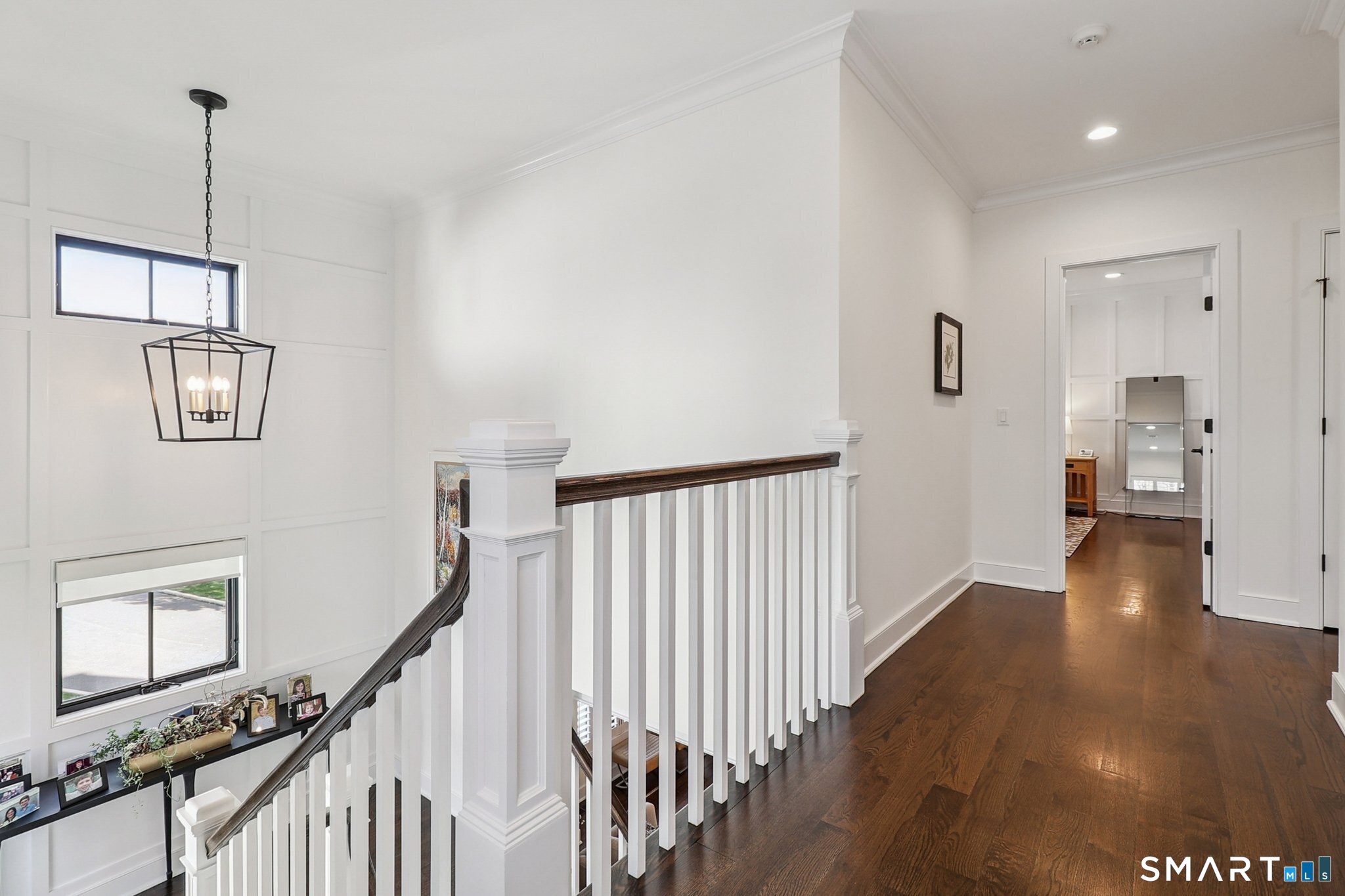 485 Westway Road, Unit 485 Fairfield, CT 06890 - Photo 17 of 39 a view of a hallway with wooden floor and staircase