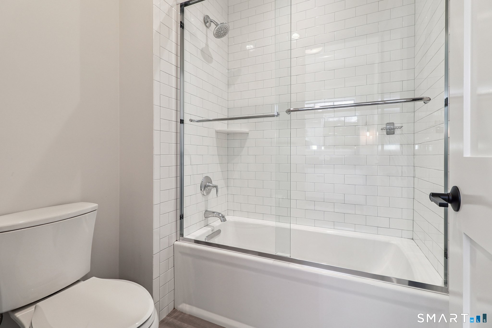 485 Westway Road, Unit 485 Fairfield, CT 06890 - Photo 26 of 39 a white bath tub sitting next to a toilet