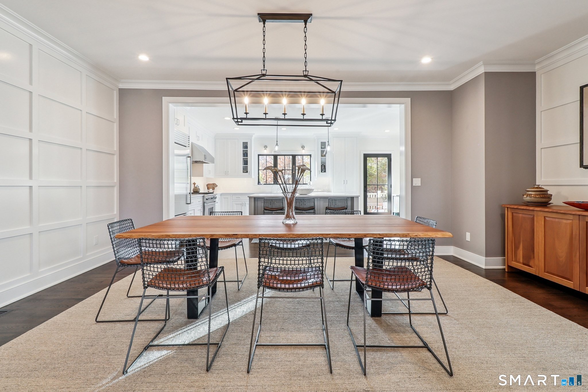 485 Westway Road, Unit 485 Fairfield, CT 06890 - Photo 7 of 39 a view of a dining room with furniture window and wooden floor