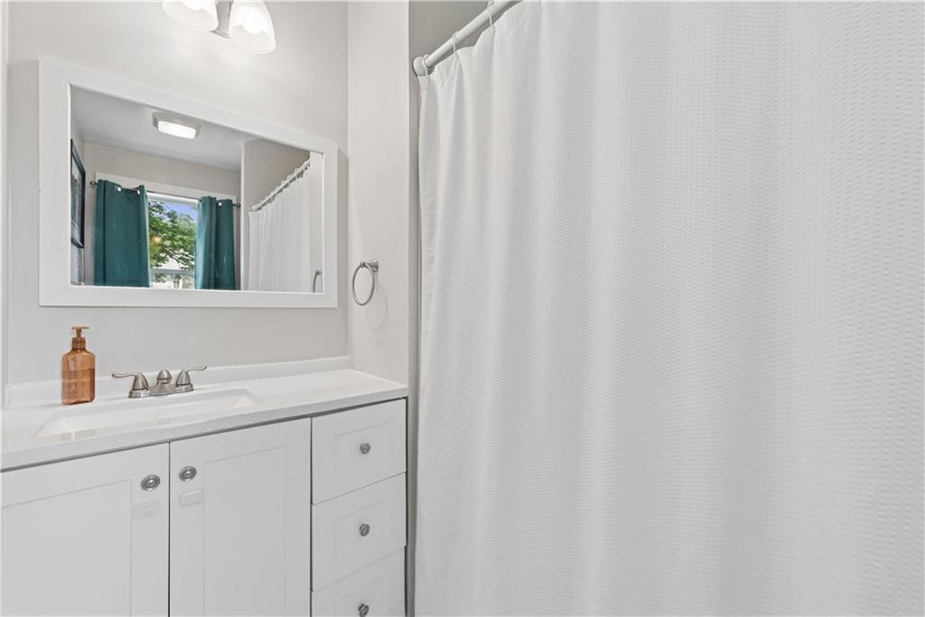 53 Calhoun Avenue Pittsburgh, PA 15210 - Photo 11 of 30 a bathroom with a sink and a mirror