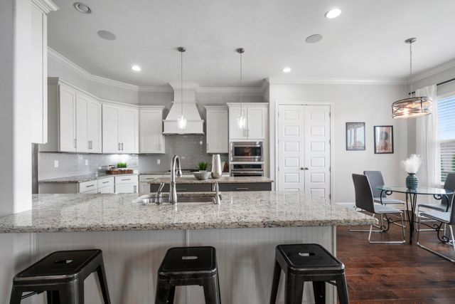 a kitchen with granite countertop a sink and counter space