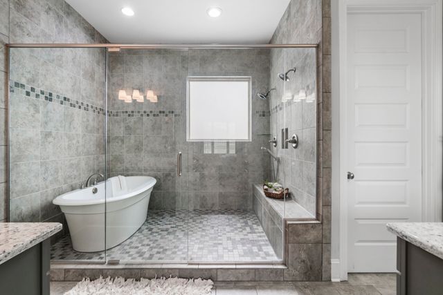 a bathroom with a shower and a mirror