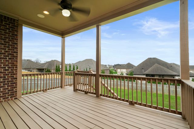 a view of balcony with wooden floor and fence