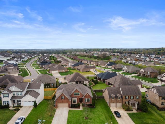 an aerial view of a house with a garden