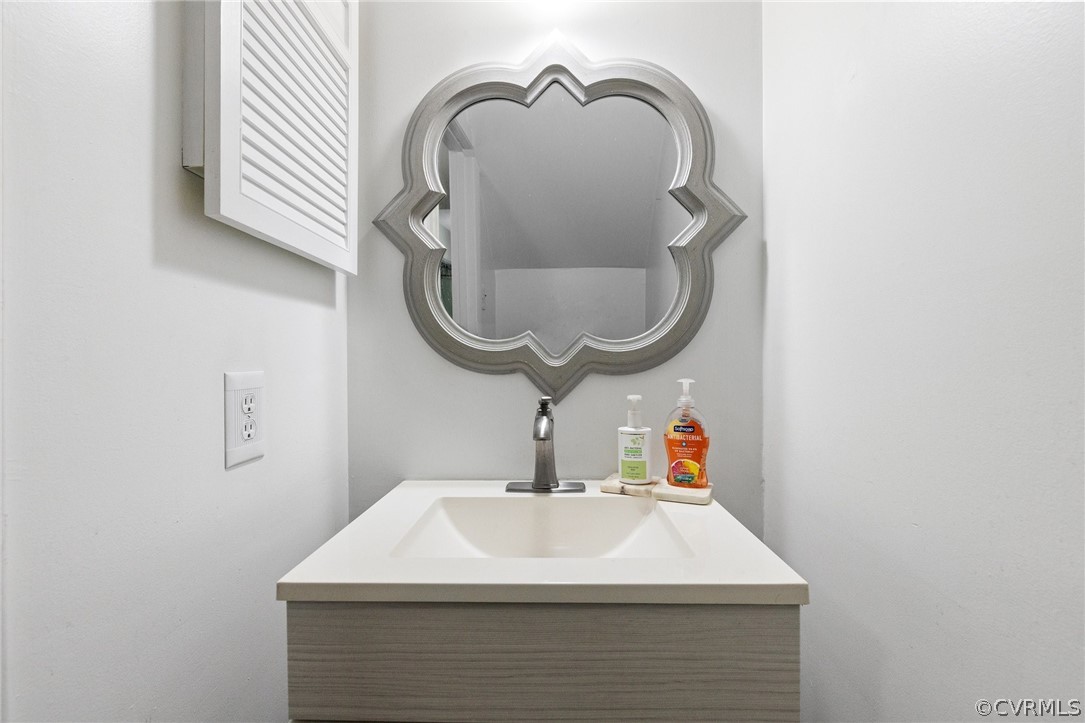 1413 Ransco Road North Chesterfield, VA 23235 - Photo 15 of 24 a bathroom with a sink and a mirror