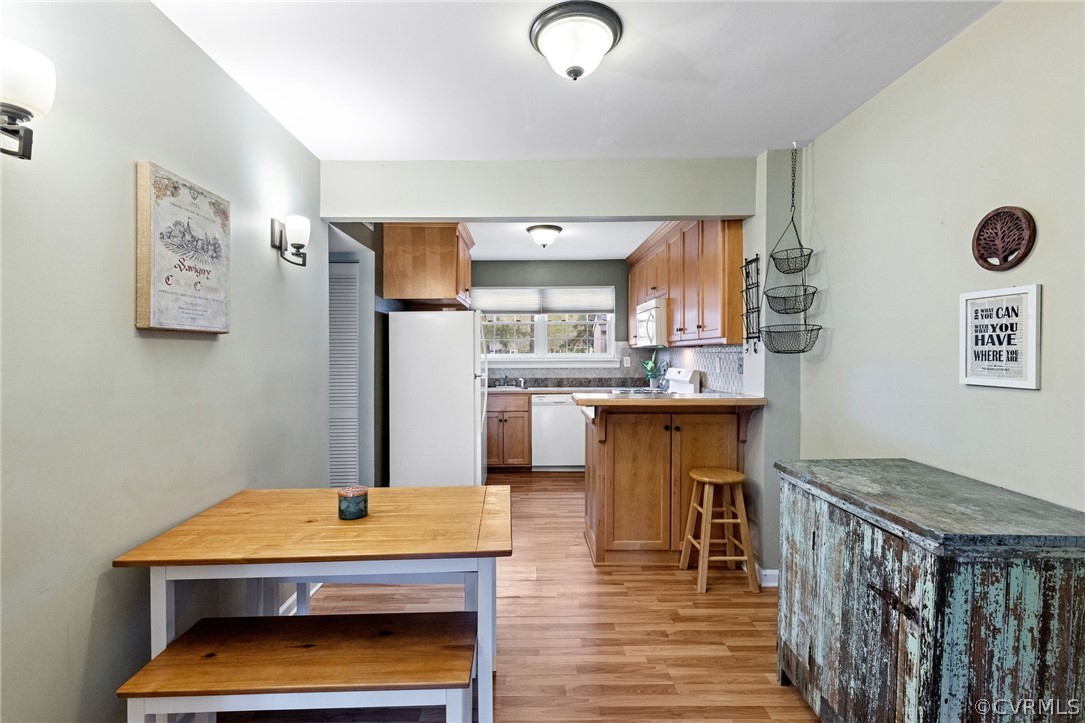 1413 Ransco Road North Chesterfield, VA 23235 - Photo 7 of 24 a kitchen with stainless steel appliances granite countertop a refrigerator and a stove top oven