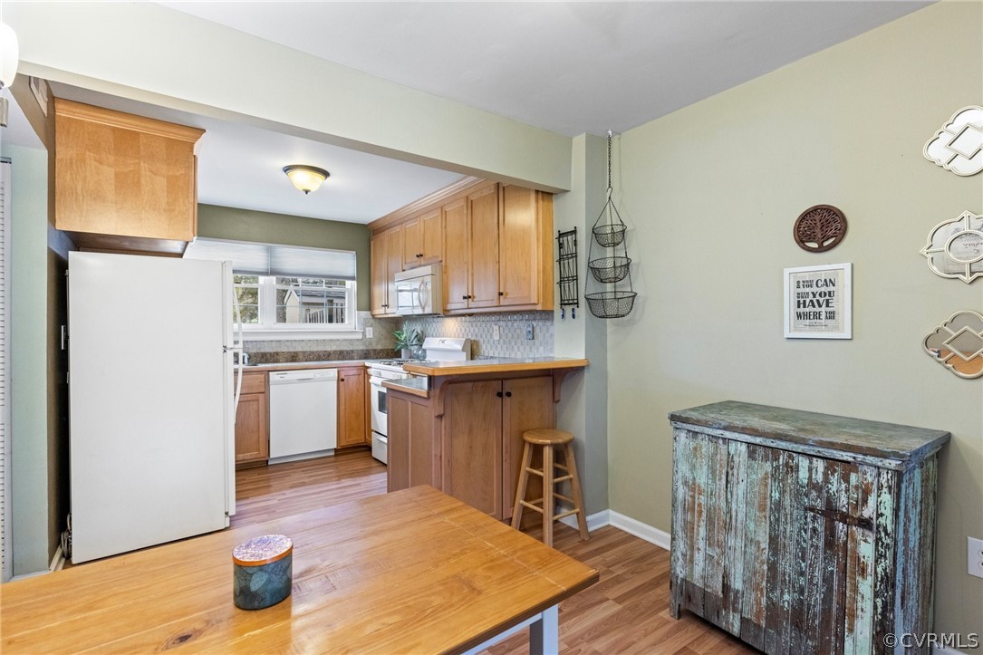 1413 Ransco Road North Chesterfield, VA 23235 - Photo 8 of 24 a kitchen with a refrigerator and countertop