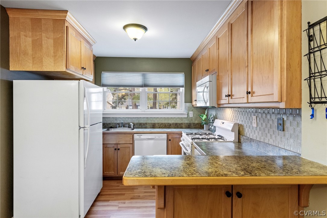 1413 Ransco Road North Chesterfield, VA 23235 - Photo 9 of 24 a kitchen with stainless steel appliances granite countertop a refrigerator sink and cabinets