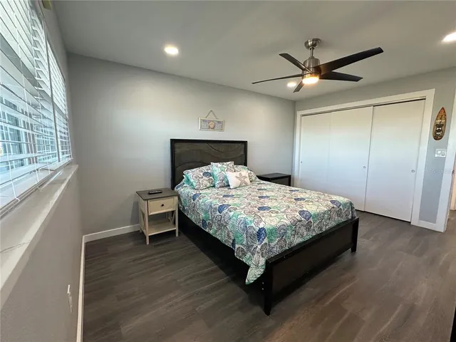 a large kitchen with stainless steel appliances kitchen island granite countertop a stove a refrigerator a sink a oven with a dining table and chairs