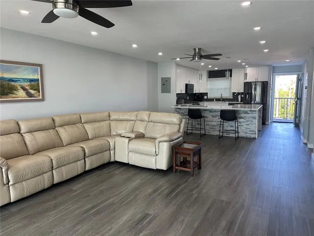 a living room with a couch and a large window