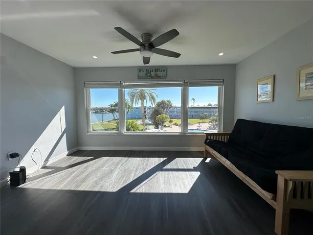 a bedroom with a large bed and a tv