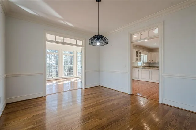 a view of a livingroom with a ceiling fan and window