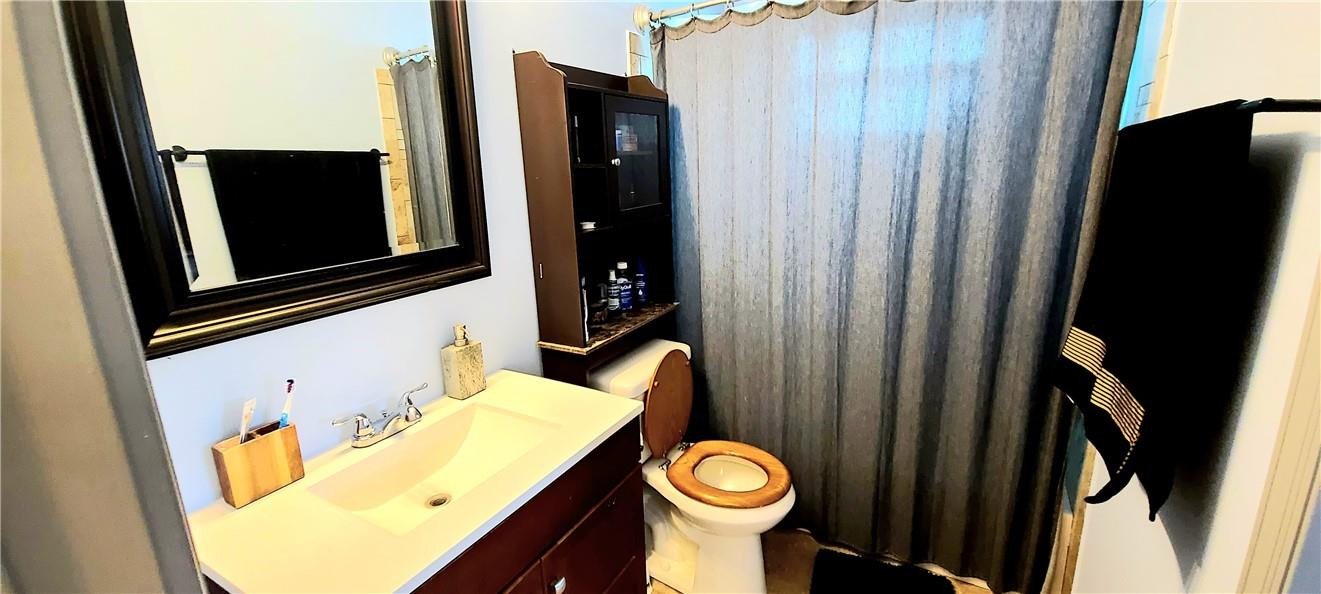 361 Northwest 37th Street Pompano Beach, FL 33064 - Photo 12 of 21 a bathroom with a sink and a mirror