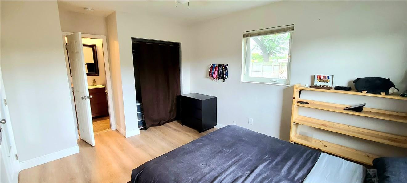 361 Northwest 37th Street Pompano Beach, FL 33064 - Photo 17 of 21 a bedroom with a bed and a dresser