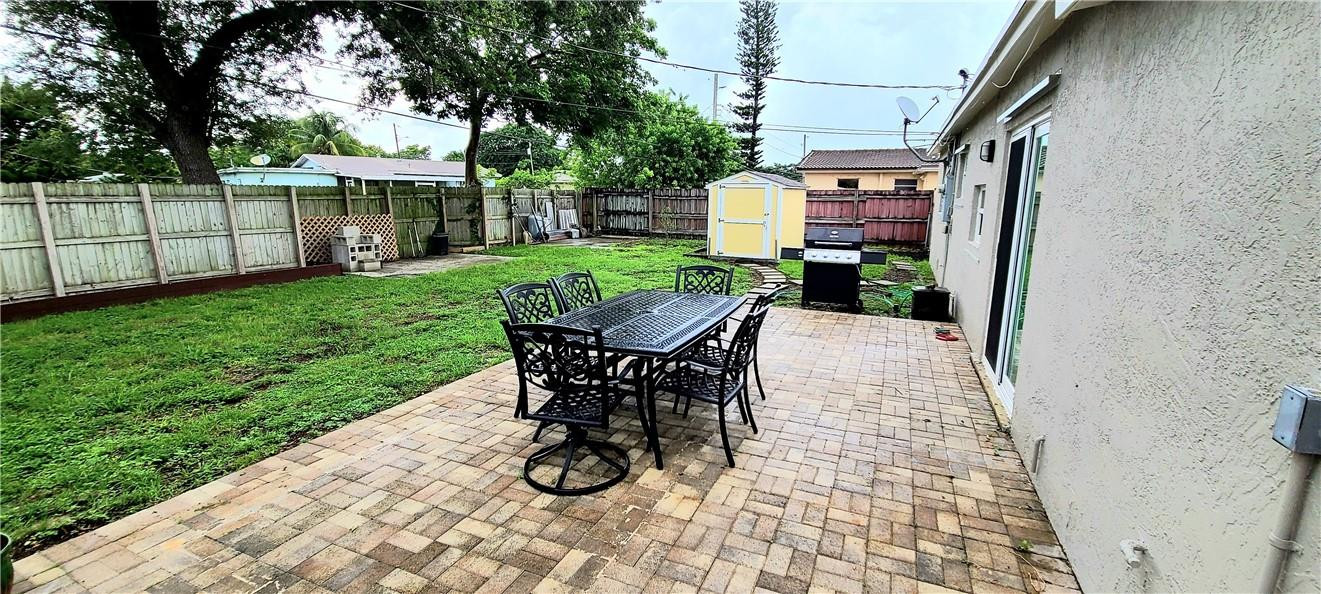361 Northwest 37th Street Pompano Beach, FL 33064 - Photo 19 of 21 a view of a backyard with sitting area