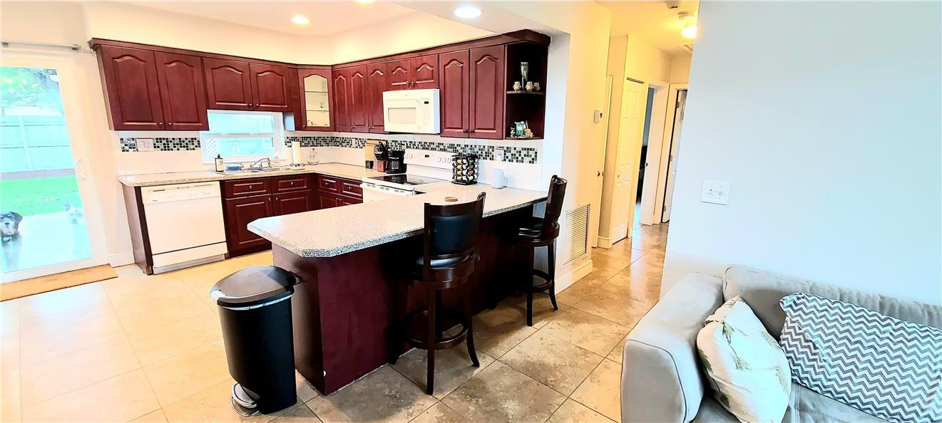 361 Northwest 37th Street Pompano Beach, FL 33064 - Photo 6 of 21 a kitchen with a sink cabinets and appliances