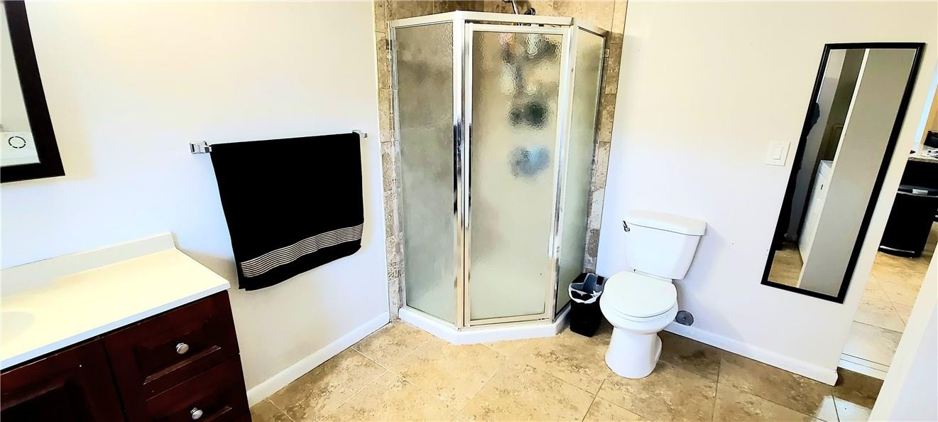 361 Northwest 37th Street Pompano Beach, FL 33064 - Photo 10 of 21 a bathroom with a toilet sink and mirror