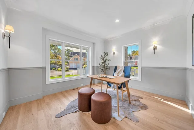 a work room with furniture and a window