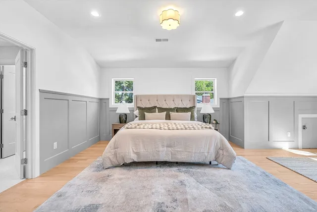 a bedroom with a bed and a cabinets