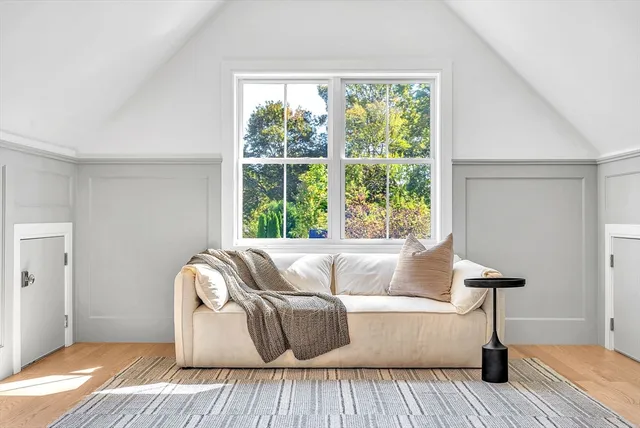 a living room with couch and a window