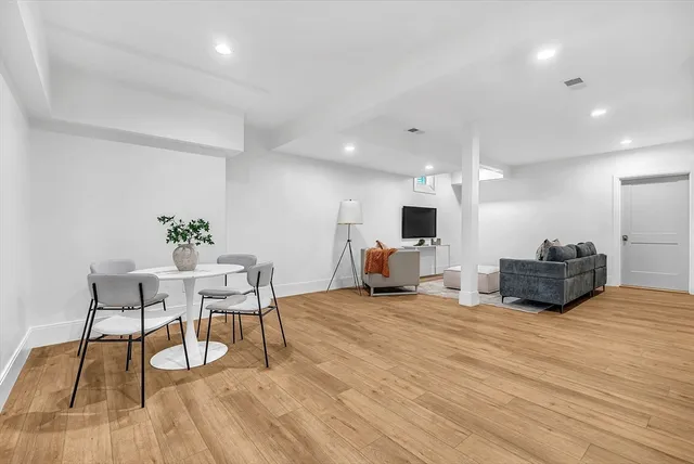 a view of a livingroom with furniture and a flat screen tv