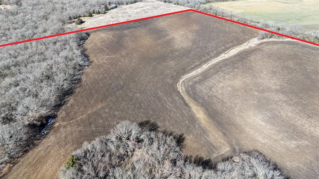 121 Sec Road Gunter, TX 75058 - Photo 24 of 40 a view of a dry yard with a road