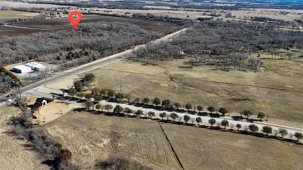 121 Sec Road Gunter, TX 75058 - Photo 26 of 40 a backyard of a house with a yard and outdoor seating