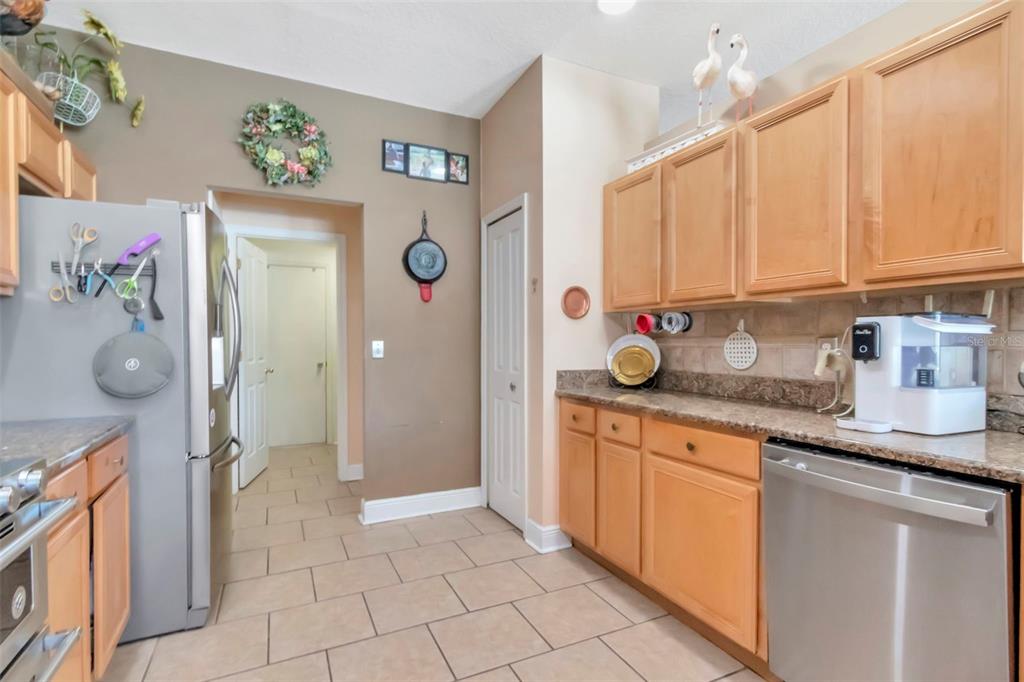 19103 Wind Dancer Street Lutz, FL 33558 - Photo 13 of 41 a kitchen with a sink window and cabinets