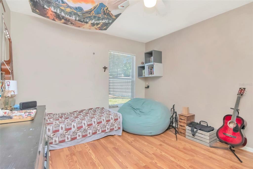 19103 Wind Dancer Street Lutz, FL 33558 - Photo 23 of 41 a bedroom with furniture and a window