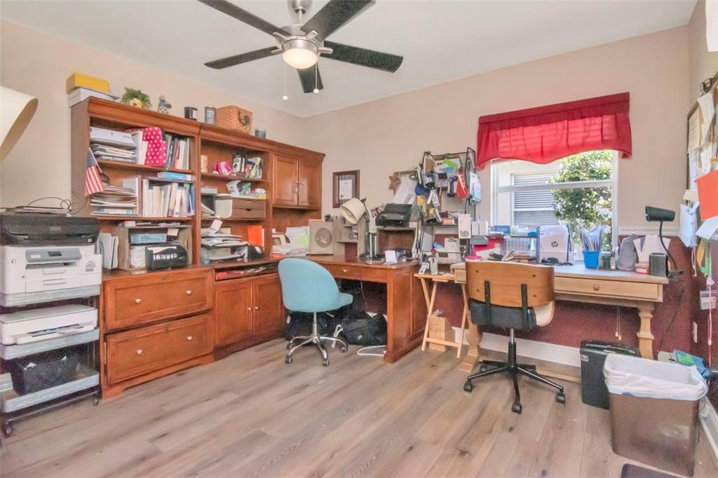 19103 Wind Dancer Street Lutz, FL 33558 - Photo 26 of 41 a room with wooden floor and furniture