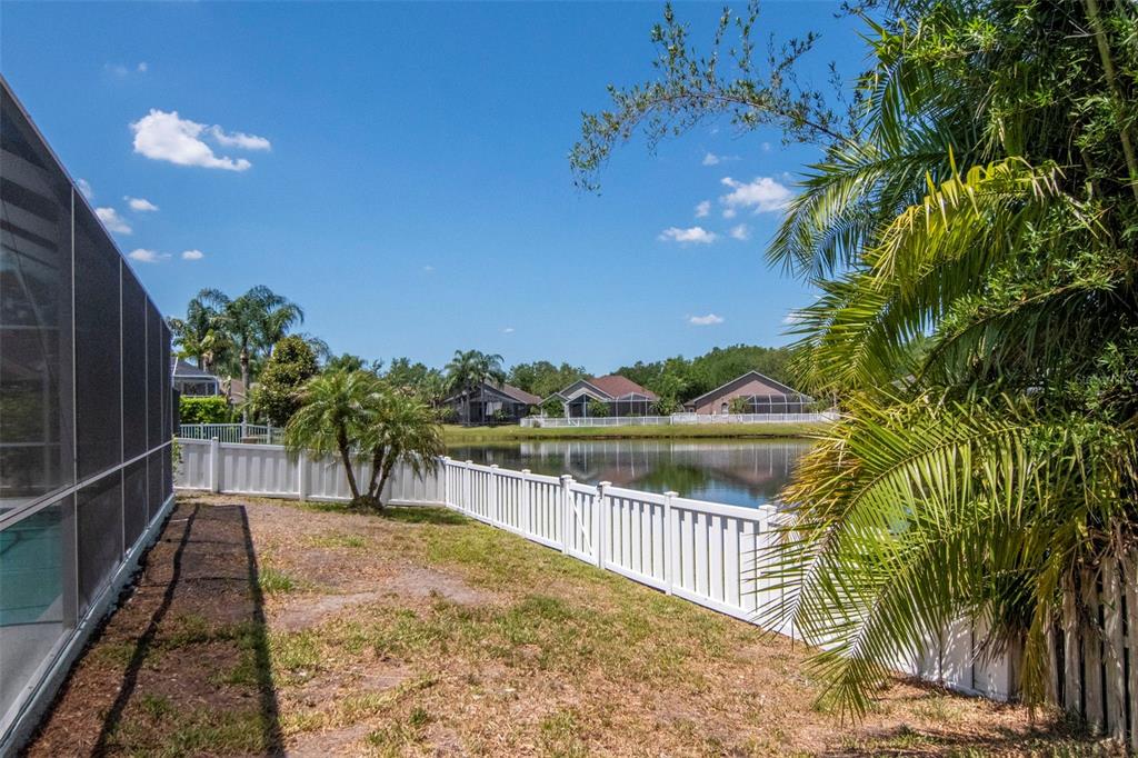 19103 Wind Dancer Street Lutz, FL 33558 - Photo 31 of 41 a view of balcony with wooden floor and lake view