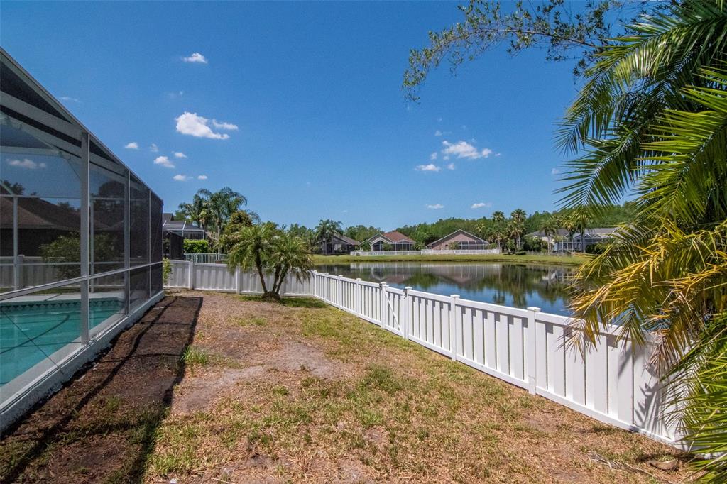 19103 Wind Dancer Street Lutz, FL 33558 - Photo 35 of 41 a view of a pathway with a wrought fence
