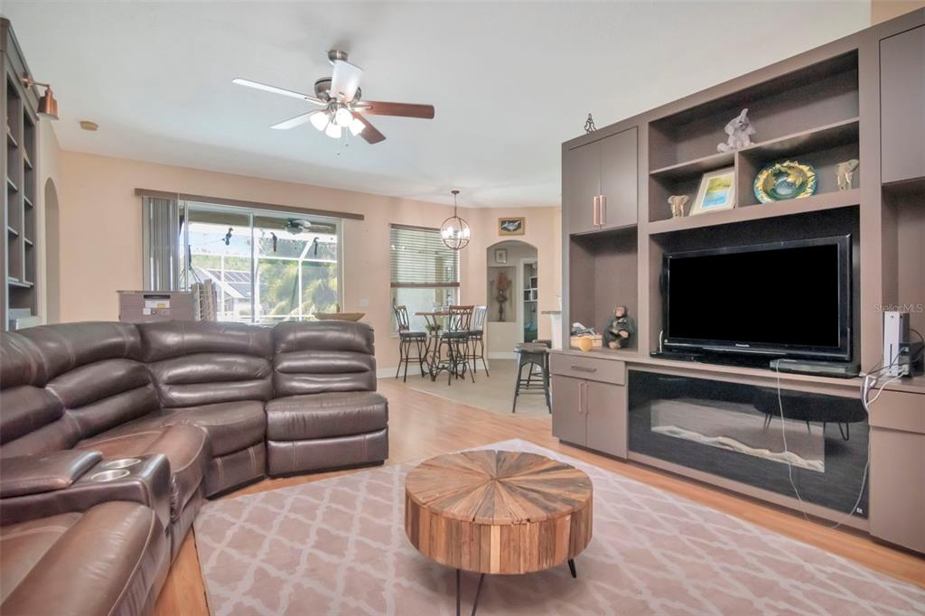 19103 Wind Dancer Street Lutz, FL 33558 - Photo 7 of 41 a living room with furniture and a flat screen tv