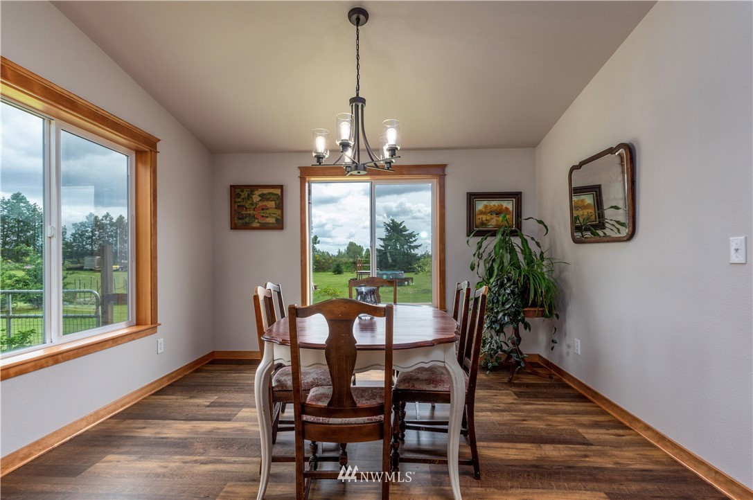 6519 190th Trail Southwest Rochester, WA 98579 - Photo 12 of 40 a dining room with furniture window wooden floor