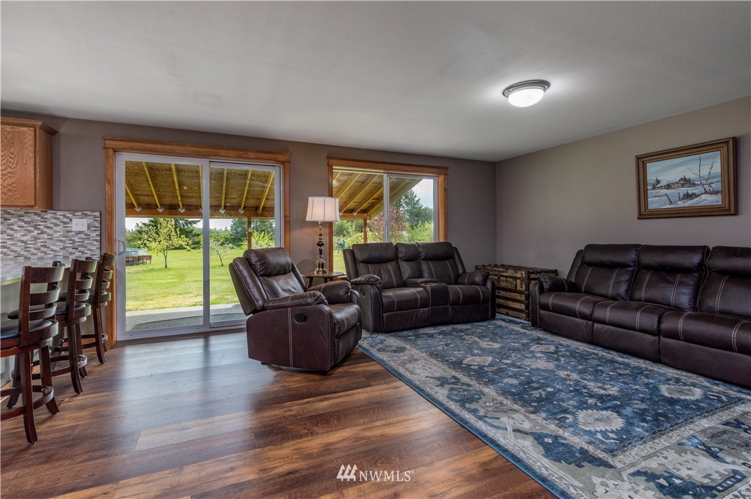 6519 190th Trail Southwest Rochester, WA 98579 - Photo 17 of 40 a living room with furniture and a fireplace