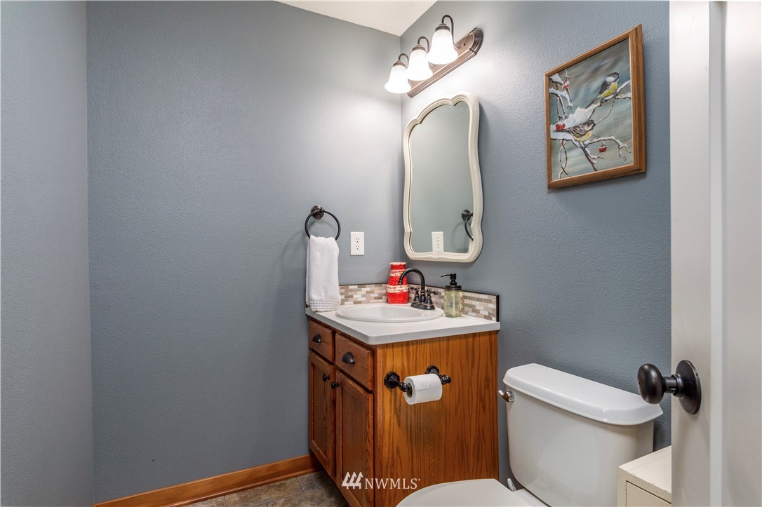 6519 190th Trail Southwest Rochester, WA 98579 - Photo 18 of 40 a bathroom with a toilet sink and mirror