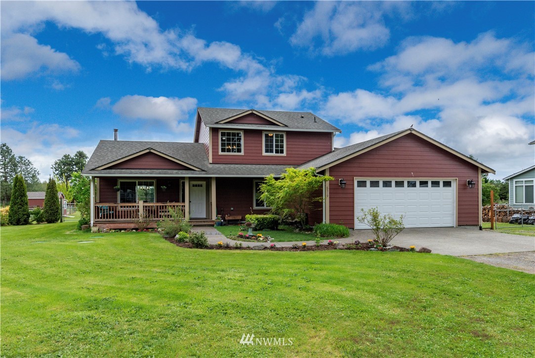 6519 190th Trail Southwest Rochester, WA 98579 - Photo 3 of 40 a front view of house with yard and green space