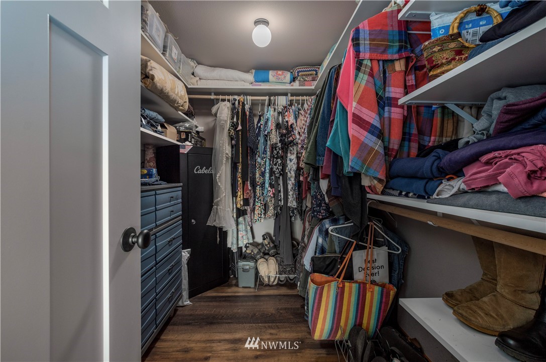 6519 190th Trail Southwest Rochester, WA 98579 - Photo 23 of 40 a view of walk in closet with clothes and shoes