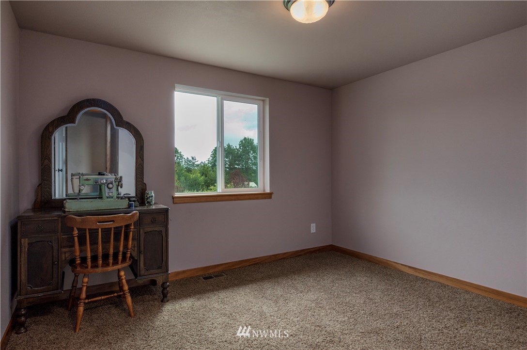 6519 190th Trail Southwest Rochester, WA 98579 - Photo 26 of 40 a view of a livingroom with furniture and window