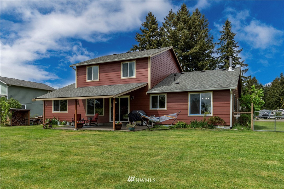 6519 190th Trail Southwest Rochester, WA 98579 - Photo 29 of 40 a front view of brick house with a yard
