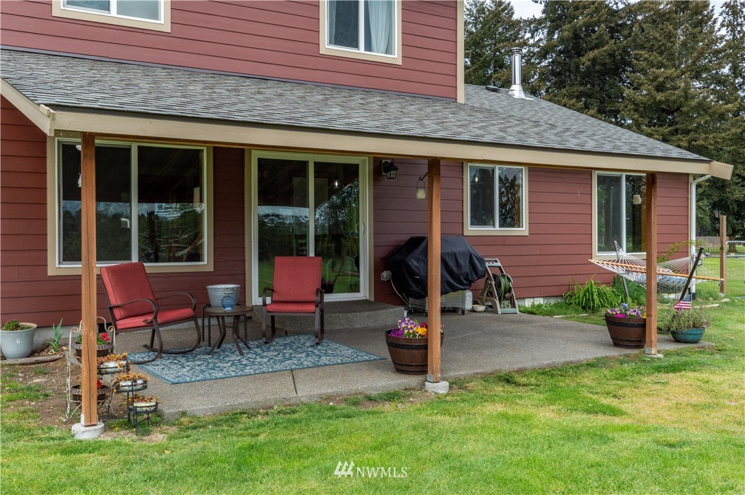 6519 190th Trail Southwest Rochester, WA 98579 - Photo 31 of 40 a front view of a house with patio
