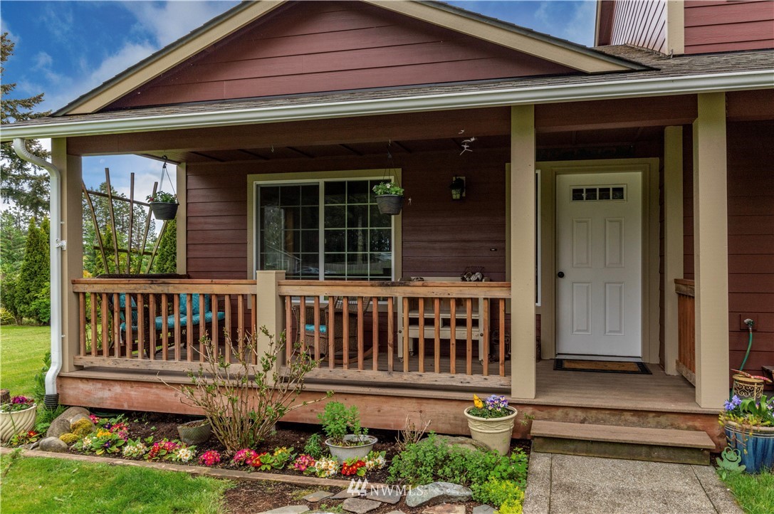 6519 190th Trail Southwest Rochester, WA 98579 - Photo 5 of 40 a front view of a house with a porch
