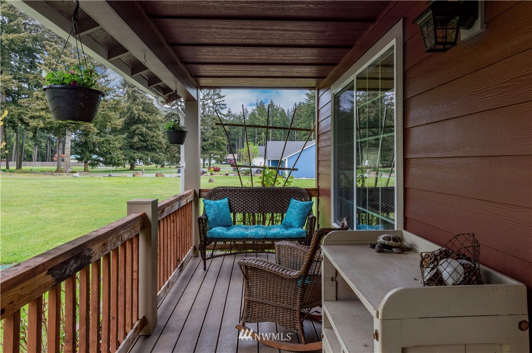 6519 190th Trail Southwest Rochester, WA 98579 - Photo 6 of 40 a view of a porch with furniture and garden
