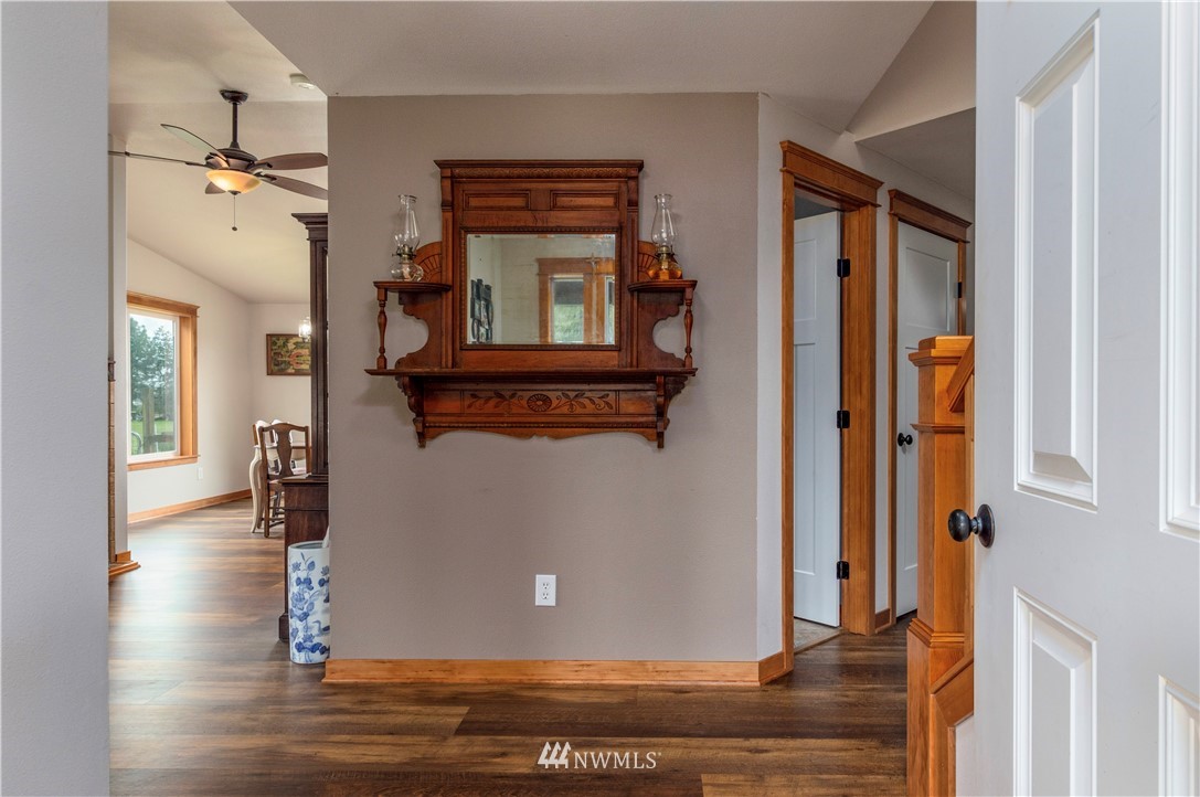 6519 190th Trail Southwest Rochester, WA 98579 - Photo 8 of 40 wooden floor in a hall with a window