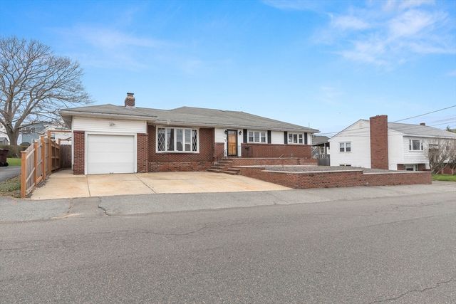 a view of multiple houses with a street