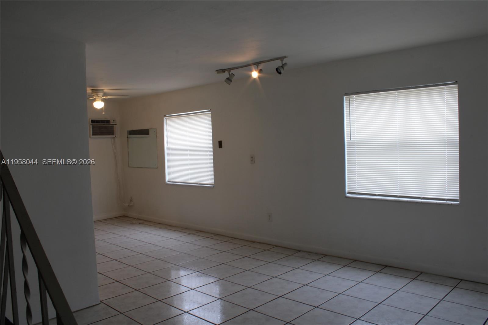 1601 Northwest 81st Street, Unit 1601 Miami, FL 33147 - Photo 2 of 13 an empty room with windows