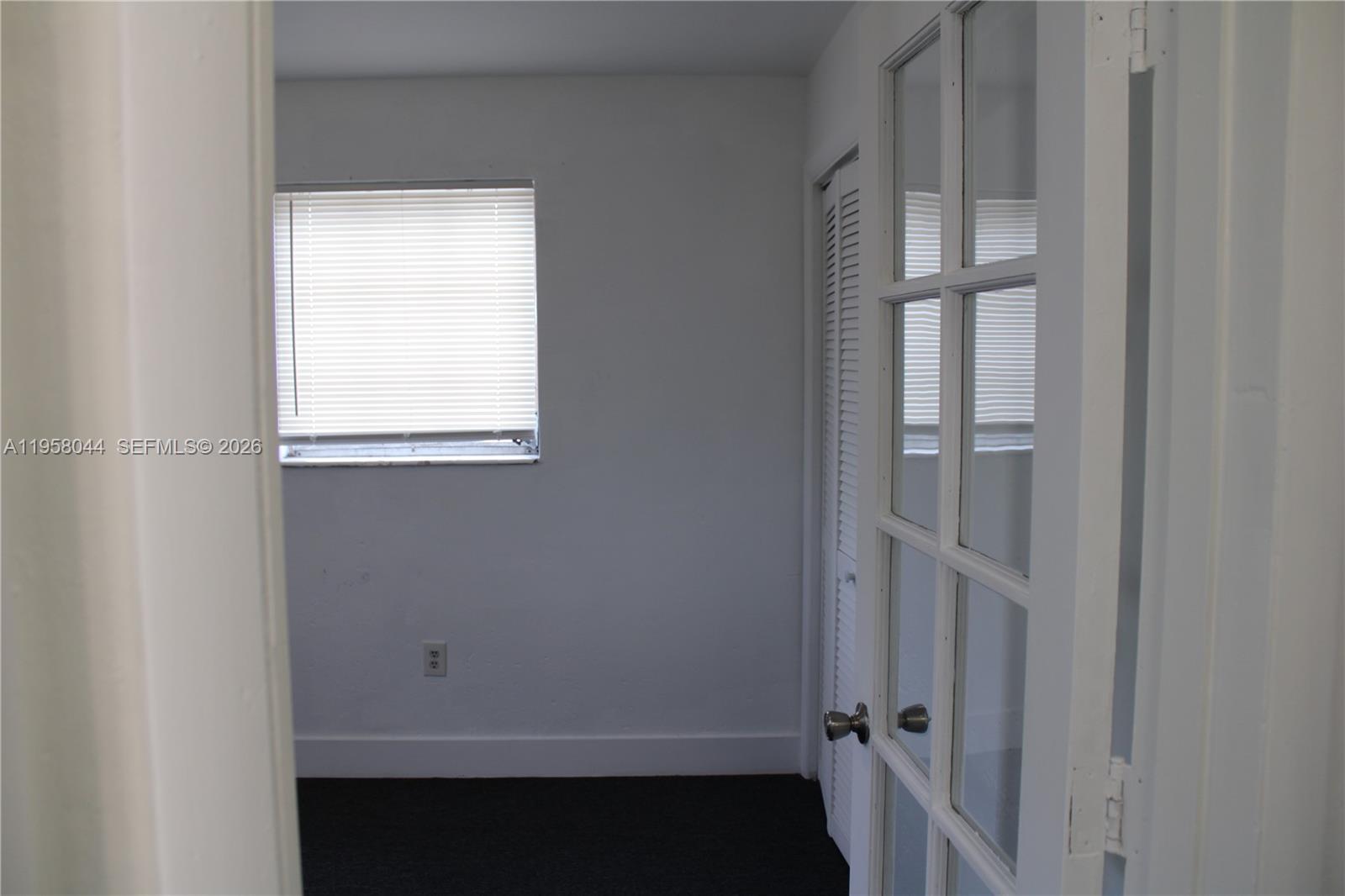 1601 Northwest 81st Street, Unit 1601 Miami, FL 33147 - Photo 7 of 13 a view of an empty room