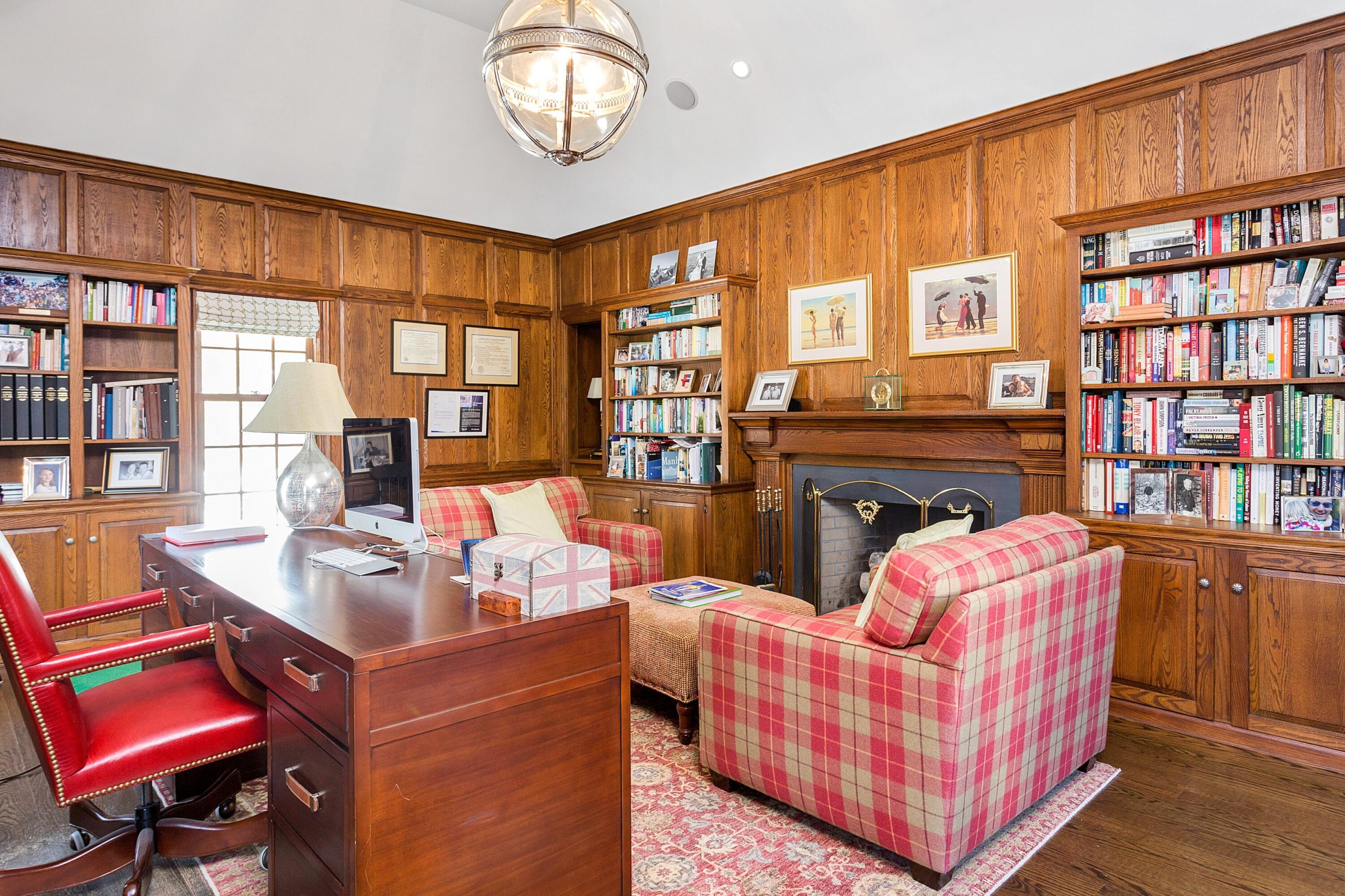 741 Hollow Tree Ridge Road Darien, CT 06820 - Photo 13 of 60 a living room with furniture fireplace and book shelf